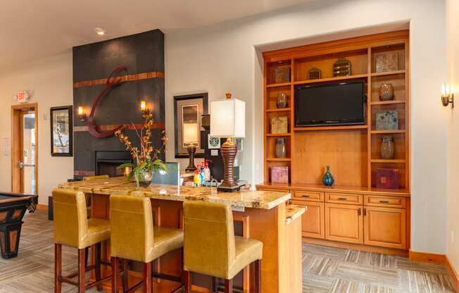 a living room filled with furniture and a flat screen tv