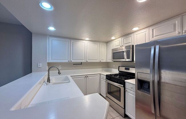 Experience the Charm of This Beautifully Updated Corner Condo