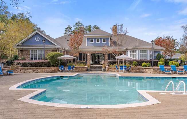 A large house with a pool in the backyard.