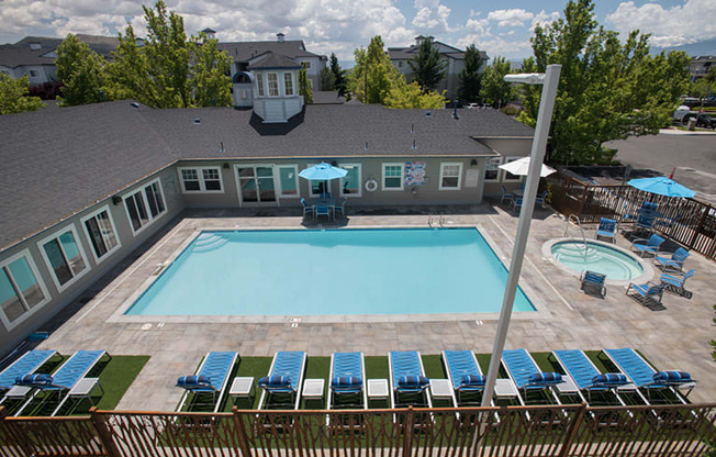 Sparkling pool with sun deck at Marina Village Apartments, NV 89434