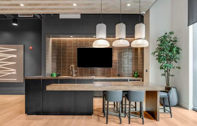 a kitchen with a large island and a table with chairs  at Cassidy on Canal, Chicago