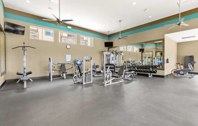 the spacious fitness center at the enclave at woodbridge apartments in sugar land, tx
