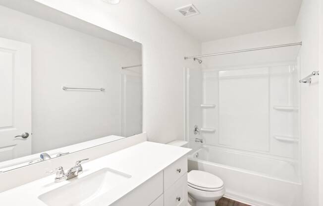 a bathroom with a sink toilet and bathtub