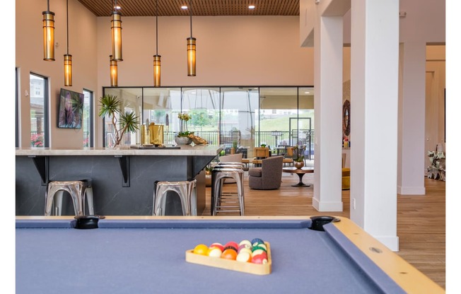 social lounge with billiards at Reveal Skyline apartments