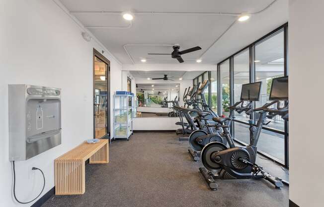 a gym with weights and cardio machines and a water fountain at The Teale Navy Yard, North Charleston, South Carolina