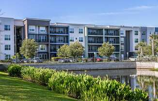 an apartment building overlooking a body of water