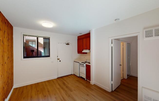 a kitchen with a stove top oven next to a doorway