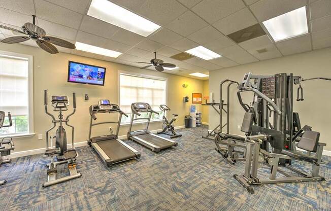 our apartments showcase a gym with equipment and a flat screen tv  at Ocean Park, Jacksonville Beach, 32250