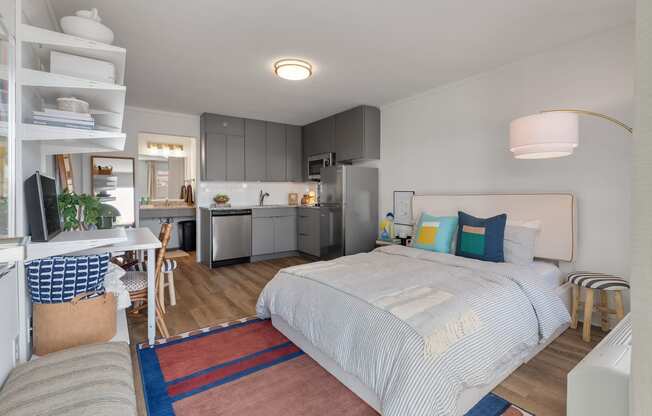 studio apartment bed desk and kitchen at The Teale Navy Yard, North Charleston, South Carolina