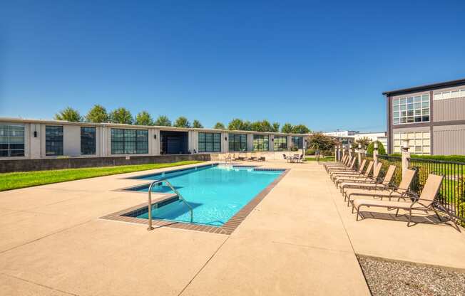 the preserve at ballantyne commons pool with chaise lounge chairs and a pool
