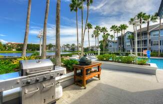 a barbecue grill sitting next to a table with a kettle on it  at Ocean Park, Florida, 32250