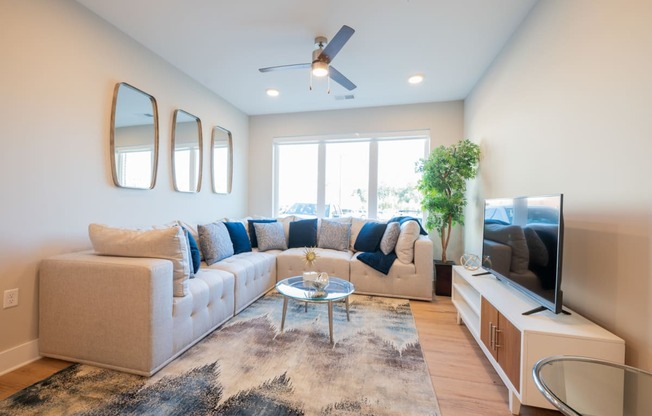 a living room with a couch and a tv