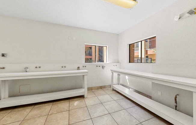 Experience convenience in this airy laundry room with ample workspace.