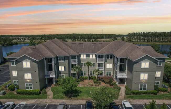 Front view of our apartment buildings at dusk in Oakleaf Plantation apartments in Jacksonville, FL
