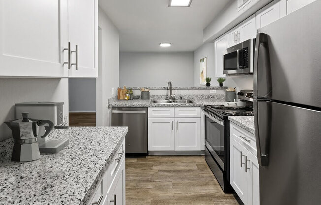 Model kitchen showcasing stainless steel appliances.