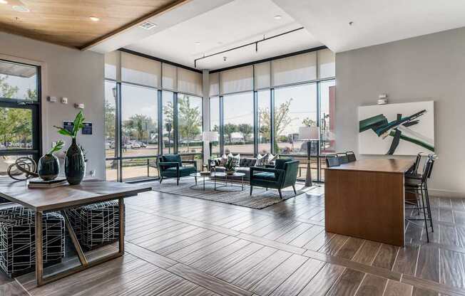 A modern living room with a wooden floor and a large window.