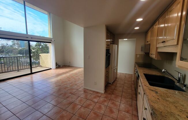 HUGE UPPER 1BD/1.5BA CONDO WITH LOFT, PARKING LAUNDRY AND 2 PRIVATE BALCONIES!!