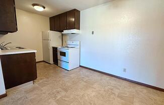 a kitchen with a sink and a refrigerator