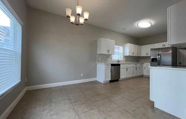 Newly Renovated 4/2.5 home in Waterford Lakes ~ New Kitchen and Baths, New Flooring, New Paint ~ Must See!