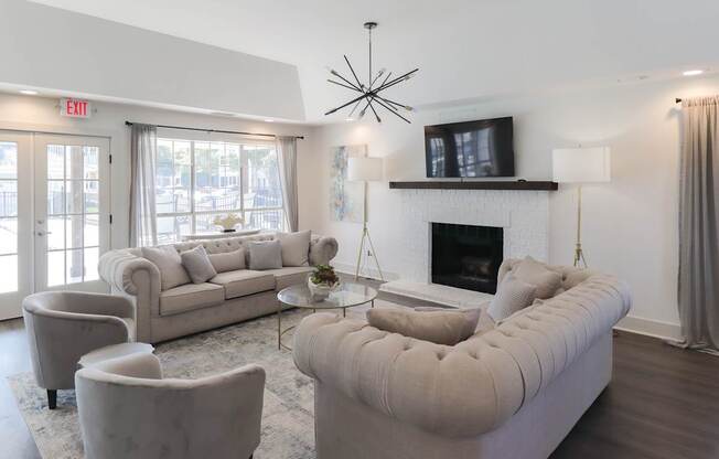 A living room with a fireplace and a large couch.