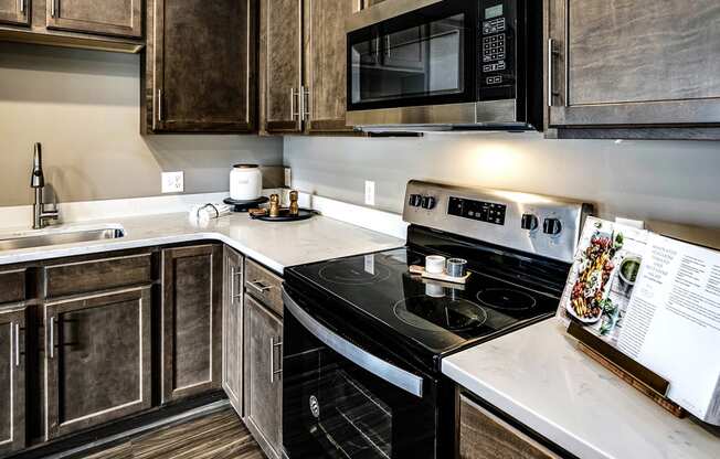 Kitchen with stainless steel appliances at Sterling Prairie Trail in Ankeny, IA