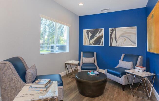 a living room filled with furniture and a window