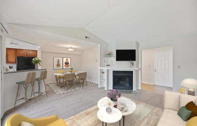 a living room with a fireplace and a table with chairs