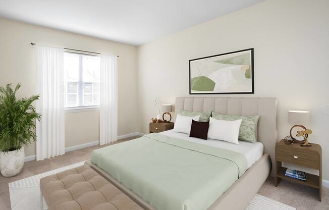 a bedroom with a bed and a window at West Pointe Apartments in Burlington, NC