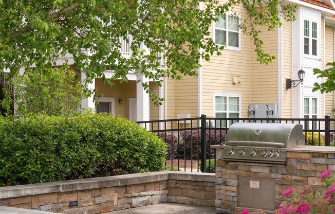 Stainless steel bbq grill in grilling area at Fenwyck Manor Apartments