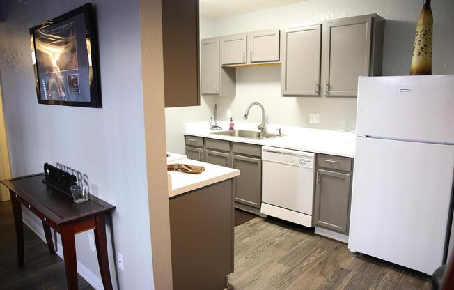 a kitchen with a sink and a mirror