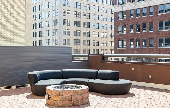 a fire pit on the roof of a building in a city