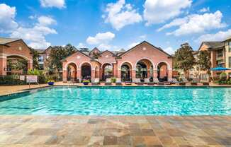the swimming pool at the estates apartments