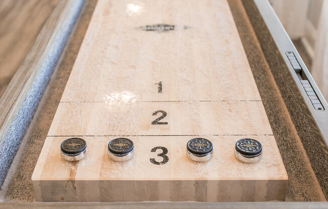 Shuffleboard Table in Game Room | The Village at Odenton Station | Apartments in Odenton, MD for Rent