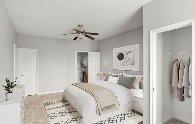 a bedroom with a ceiling fan and a bed at Veranda at Centerfield, Houston