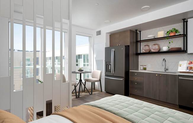 A modern kitchen with a refrigerator, sink, and cabinets.