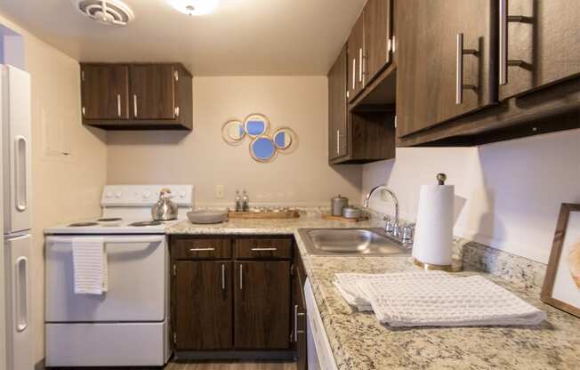 This is a picture of the kitchen in the 980 square foot, 2 bedroom, 1 bath model apartment at Fairfield Pointe Apartments in Fairfield, Ohio.