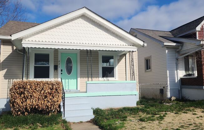 Central Location!  3 Bedrooms, 1 Bath Bungalow with Basement, Detached Garage & Fenced in Yard.