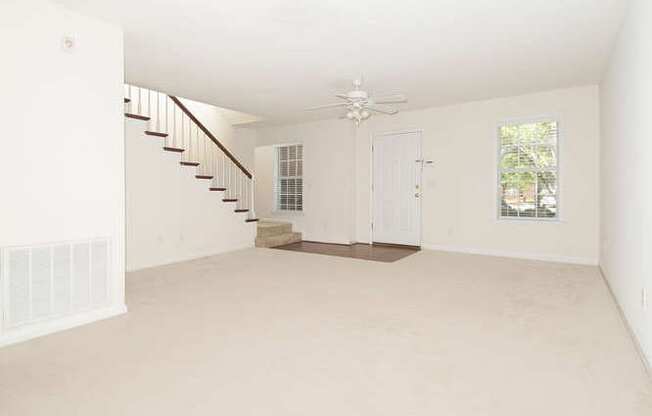 living room with stairs to second level