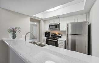 the preserve at ballantyne commons apartment kitchen with stainless steel appliances