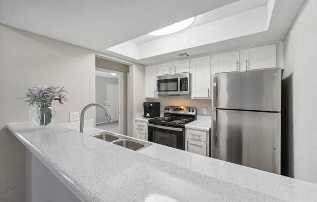 the preserve at ballantyne commons apartment kitchen with stainless steel appliances