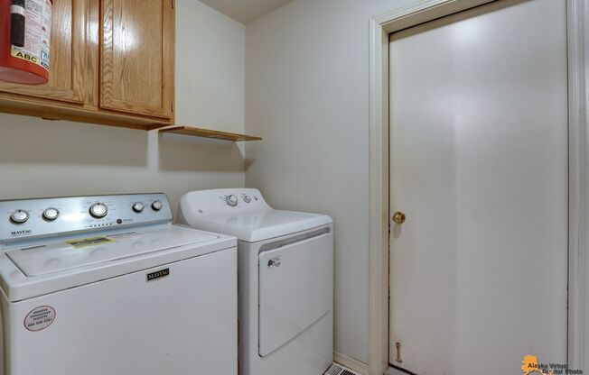 East Anchorage Condo with Fenced in Yard, W/D in unit, & 2 Car Garage! Close to JBER, Baxter Bog Park, and Baxter Elementary School.