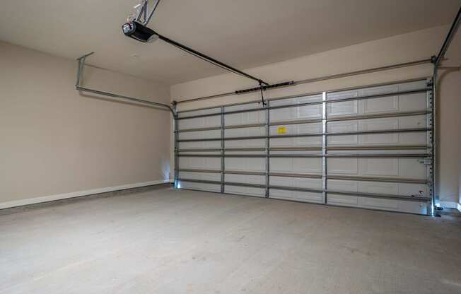the interior of a garage with a white garage door
