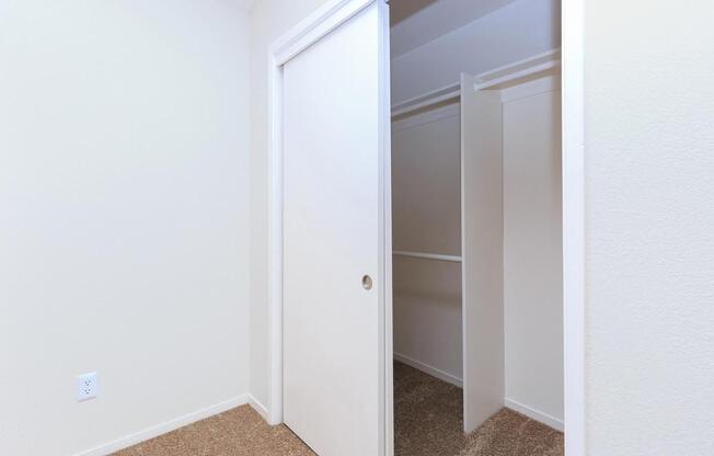 a white refrigerator freezer sitting next to a door