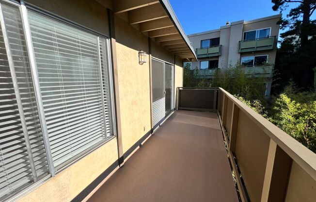 LARGE ONE BED ONE AND HALF BATH UPPER END UNIT CONDO WITH GREAT STORAGE AND TWO COVERED PARKING STALLS