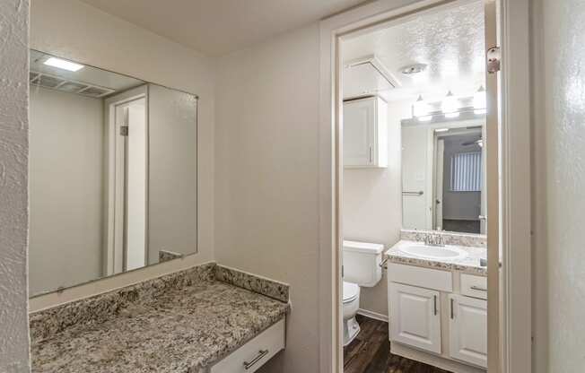 This is a photo of the vanity and bathroom in the 486 square foot 1 bedroom apartment at The Summit at Midtown Apartments in Dallas, TX.