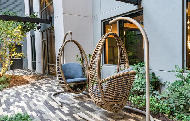 Unwind in the zen garden at Modera Old Ivy, where suspended loungers and thoughtful design create a quiet retreat near Buckhead.