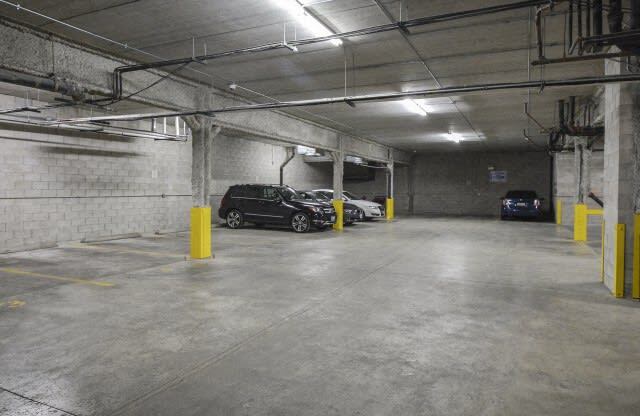 a large parking garage with cars parked in it