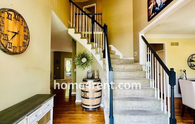 Beautiful Four Bedroom Home in a Quiet Neighborhood w/ an Updated Kitchen, Wood Floors, and a Finished Basement!