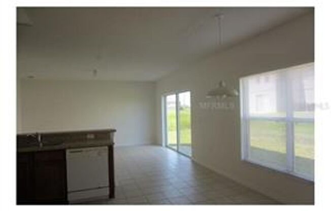 4 bedroom,  2.5 Baths located at 1348 Nelson Park Ct Poinciana, FL 34759.