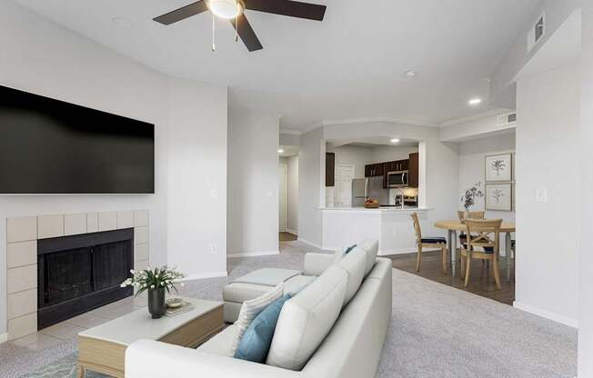 a living room with a couch and a fireplace